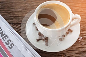 Coffee cup with coffee beans and coffee leaves