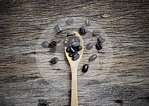 Coffee cup and coffee beans roasted in sack on a wooden floor