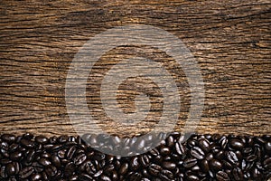 Coffee cup and coffee beans roasted in sack on a wooden floor