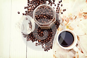 Coffee cup and coffee beans on table,banner free space for your text.