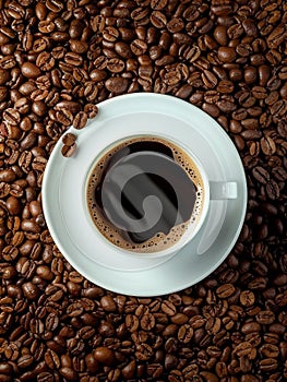 Coffee cup and coffee beans and wooden table