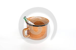 Coffee cup and coffee sachets on white background.