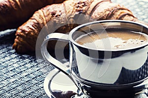 Coffee. Cup of coffee. Stainless steel cup of coffee and two croissants. Coffee break business break