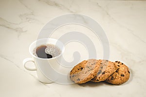 coffee cup and cookies with chocolate/coffee cup and cookies with chocolate on a marble background