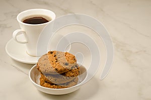 Coffee cup and cookies with chocolate/coffee cup and cookies with chocolate on a marble background, copy space