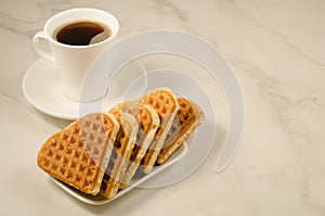 Coffee cup and cookies heart/coffee cup and cookies heart on a marble background, copy space