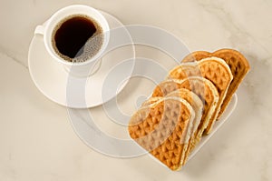 Coffee cup and cookies heart/coffee cup and cookies heart on a marble background, top view