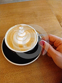 Coffee cup with decoration art by barista photo