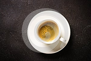 Coffee cup. espresso in white cup at dark table.