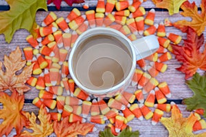 Coffee cup fall background with intentional focus on the white m