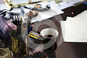 Coffee cup on fashion desk