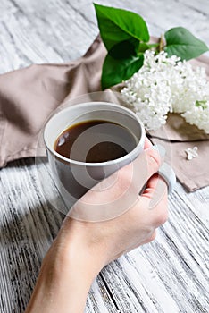 Coffee cup in a female hand