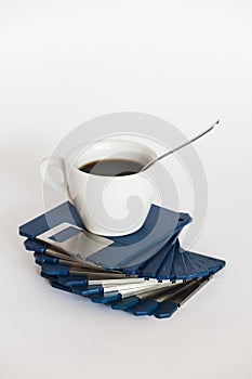 Coffee cup on floppy disks