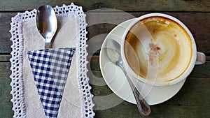 Coffee cup or fresh coffee on wooden table in morning time