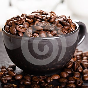 Coffee cup full of coffee beans