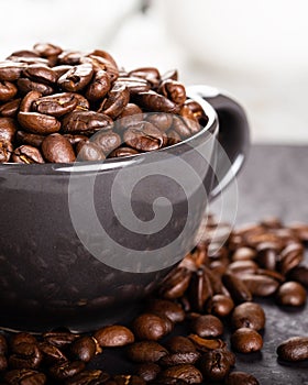 Coffee cup full of coffee beans