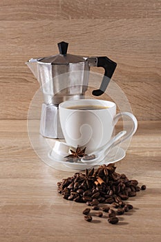Coffee cup, geyser coffee maker, coffee beans
