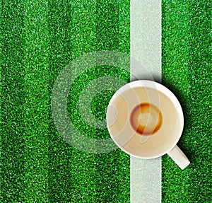 Coffee cup and grass.