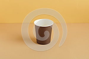 Coffee cup on ground color background