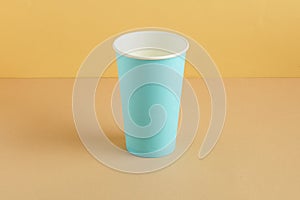 Coffee cup on ground color background