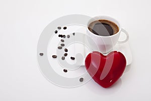 Coffee cup with heart and coffee beans
