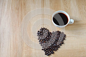 Coffee cup and heart-shaped coffee beans