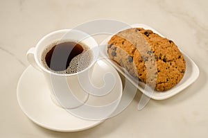 coffee cup and homemade cookies/ Breakfast whith coffee cup and homemade cookies on a marble background