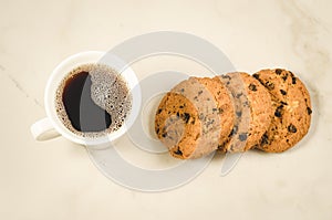 Coffee cup and homemade cookies with chocolate/Breakfast whith coffee cup and homemade cookies with chocolate on a marble