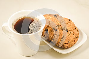 Coffee cup and homemade cookies with chocolate/coffee cup and homemade cookies with chocolate on a marble background