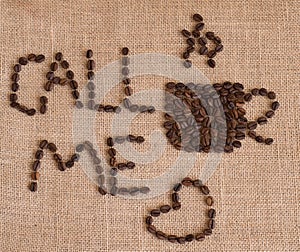 Coffee cup image made up of coffee beans on burlap background