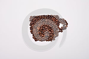 Coffee cup image made up of coffee beans on a white background