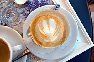 Coffee cup with latte art.