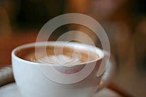 Coffee Cup with Latte Art and a Lipstick Print