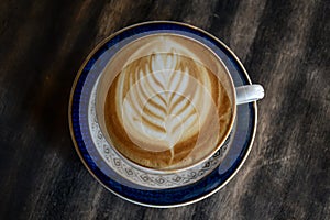 coffee cup latte art on table