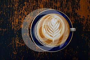 Coffee cup latte art on table