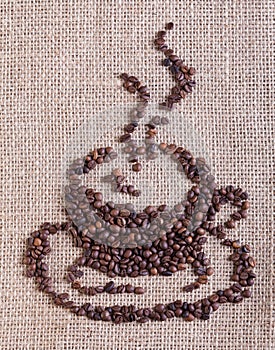 Coffee cup made of beans - on burlap background