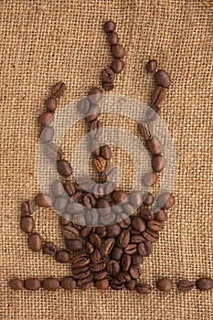 Coffee cup made â€‹â€‹of coffee beans on a burlap