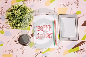 Coffee cup, notebook and ebook