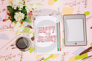 Coffee cup, notebook and ebook