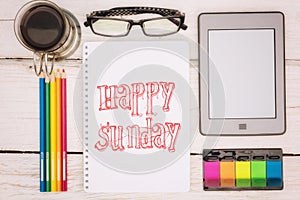 Coffee cup, notebook and ebook