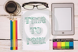 Coffee cup, notebook and ebook