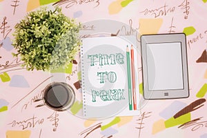 Coffee cup, notebook and ebook