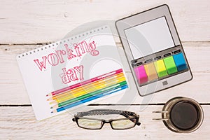 Coffee cup, notebook and ebook