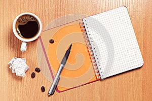 Coffee cup and notepad