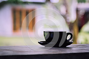 Coffee cup on old wooden table