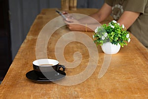 Coffee cup on an old wooden table