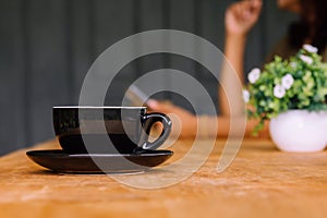 Coffee cup on an old wooden table