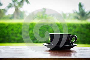 Coffee cup on old wooden table