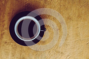 Coffee cup on old wooden table