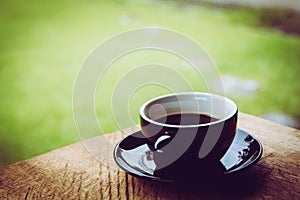 Coffee cup on old wooden table